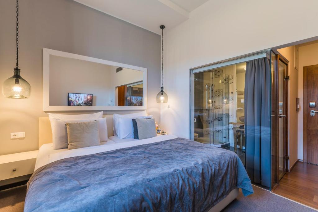 Voodi või voodid majutusasutuse Wellness & spa hotel Augustiniánský dům toas