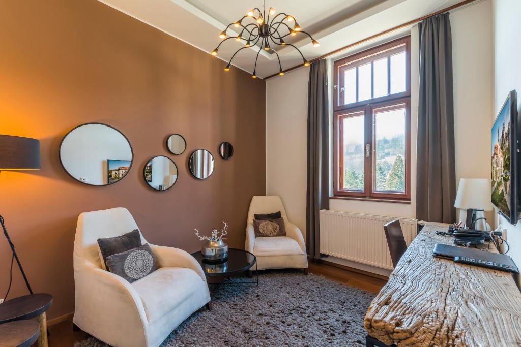 Televiisor ja/või meelelahutuskeskus majutusasutuses Wellness & spa hotel Augustiniánský dům