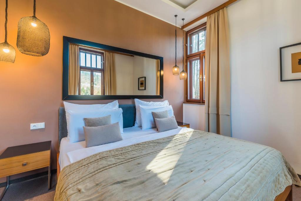 Voodi või voodid majutusasutuse Wellness & spa hotel Augustiniánský dům toas