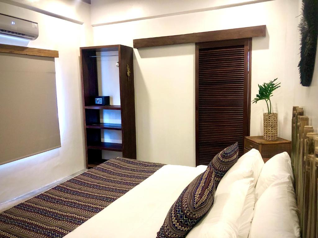 Postel nebo postele na pokoji v ubytování Yumi Villas