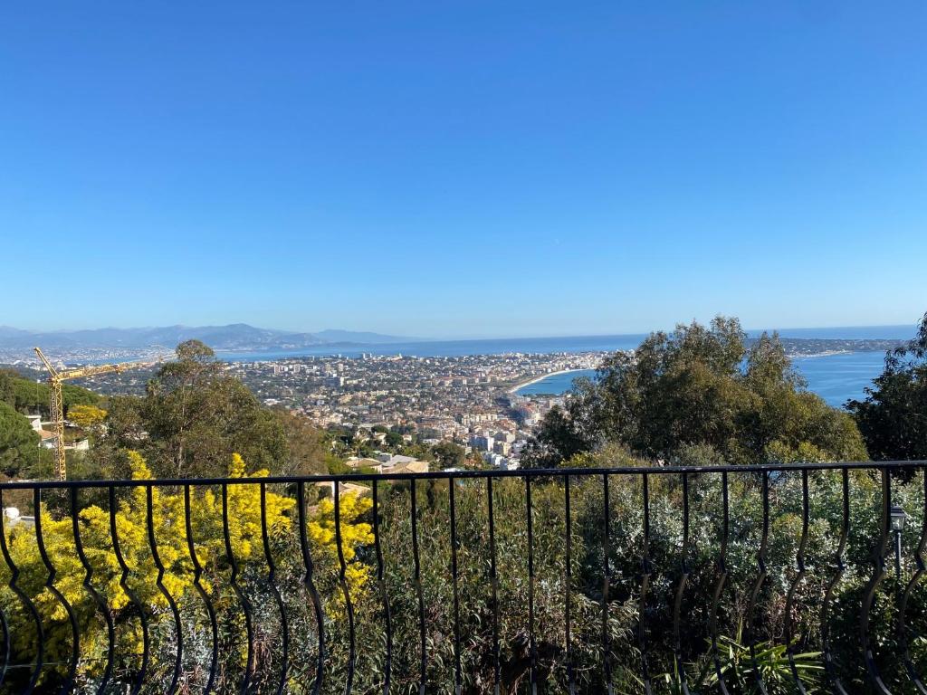 a view of the city from the top of a hill at VILLA LE MAS D&#39;AZUR BY ESTATESCANNES in Vallauris