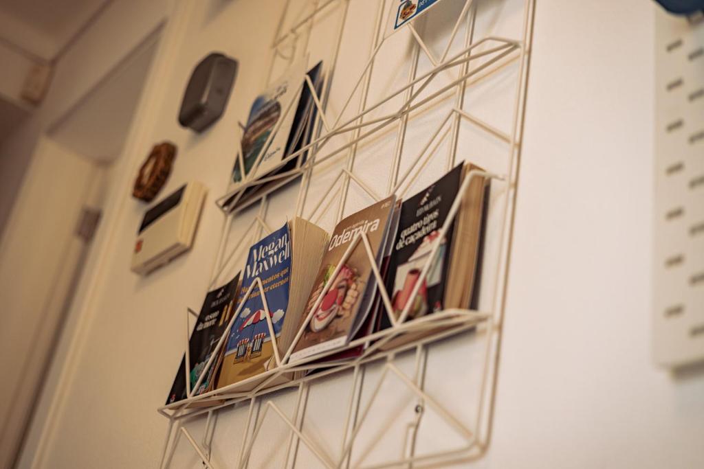 a group of signs hanging on a wall at Breathe In in Zambujeira do Mar