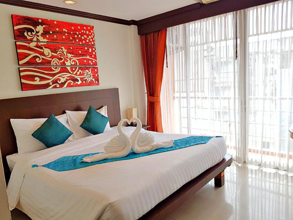 Postel nebo postele na pokoji v ubytování Southern Comfort Patong