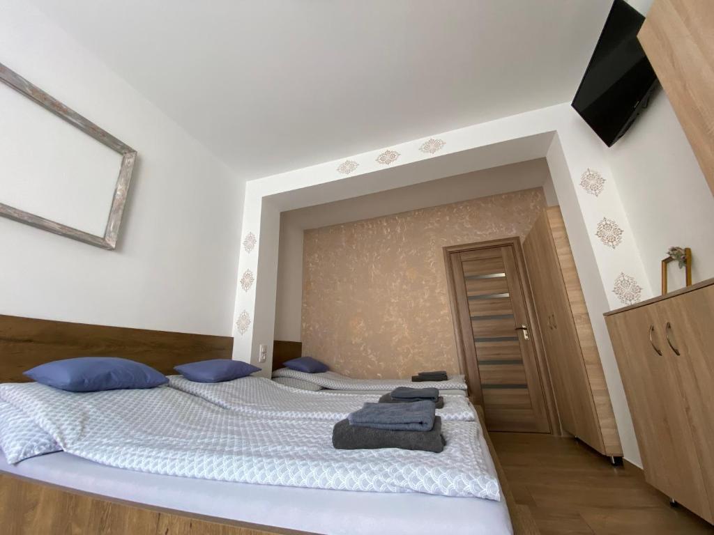 Postel nebo postele na pokoji v ubytování VÁR-LAK Apartman