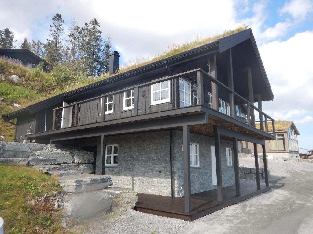 a house on the side of a hill at Norefjell Panorama in Noresund