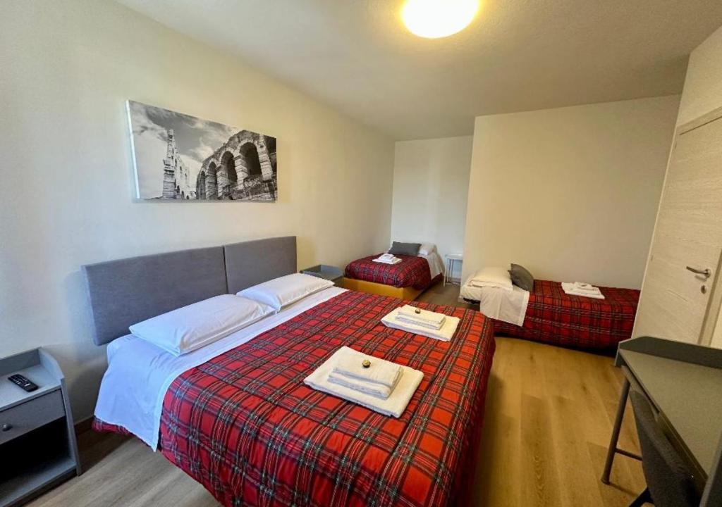 Postel nebo postele na pokoji v ubytování Sulla Ciclabile Apartment lungo il fiume Adige