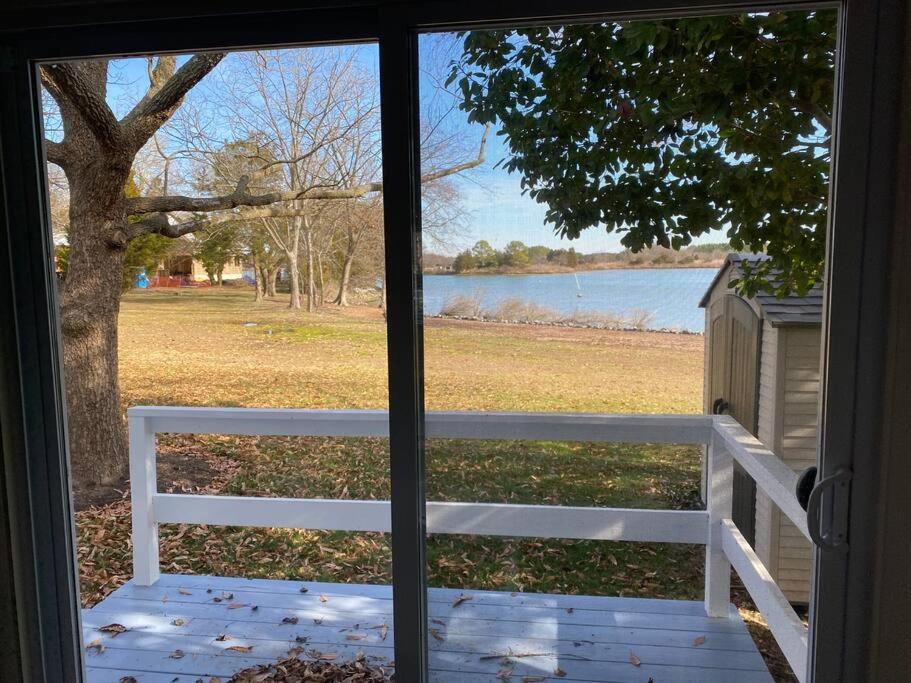 a window view of a lake from a porch at Newly Renovated Guest House in Oxford