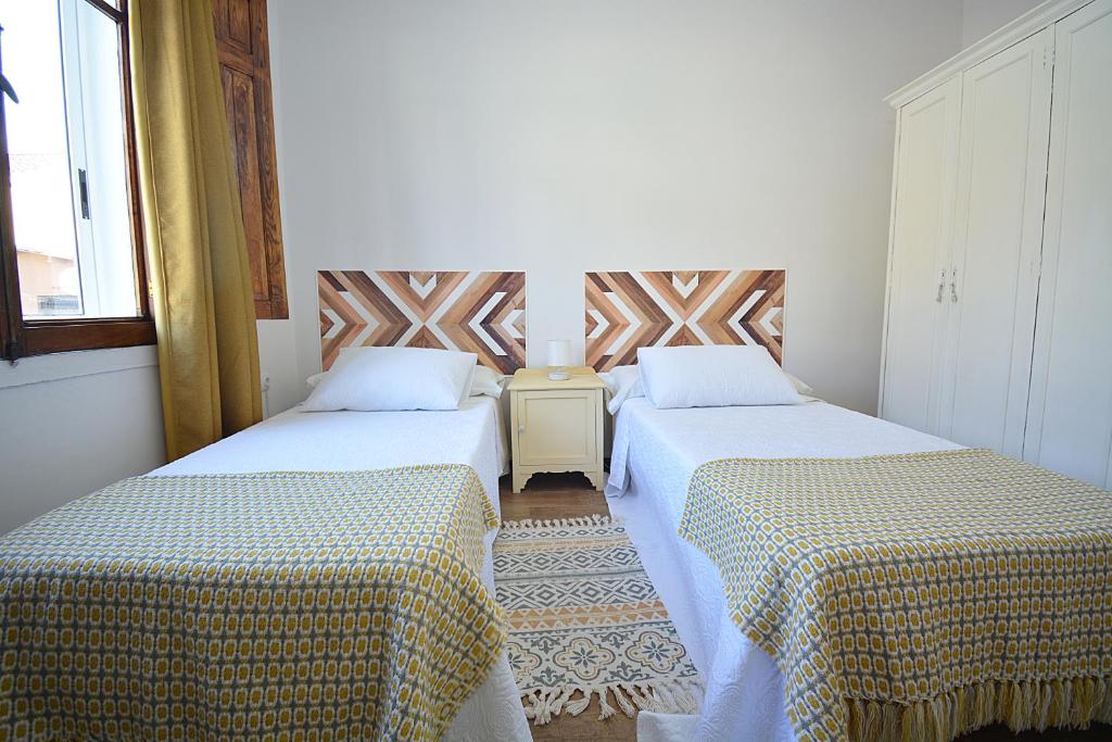 Postel nebo postele na pokoji v ubytování Casa Felisa - Vilagarcía de Arousa