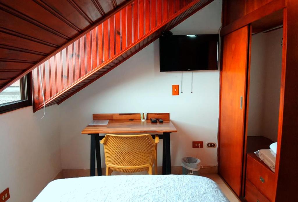 Postel nebo postele na pokoji v ubytování Trebol Amarillo Bed & Breakfast