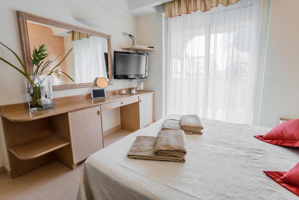 Postel nebo postele na pokoji v ubytování Hotel Derby Exclusive