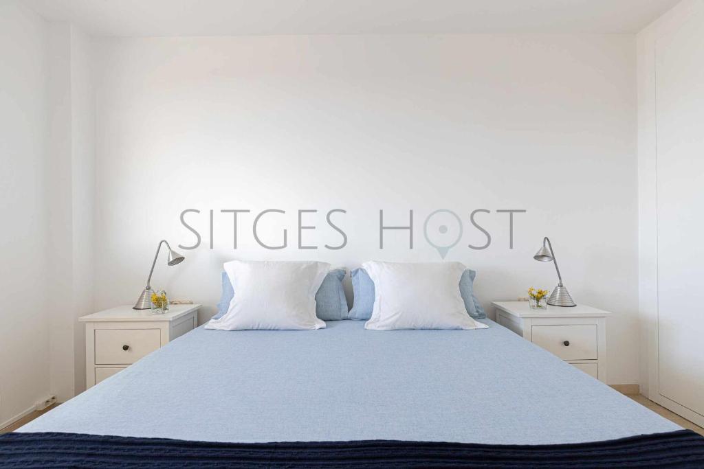 Posteľ alebo postele v izbe v ubytovaní Sitges ARENA dos piscinas frente al mar