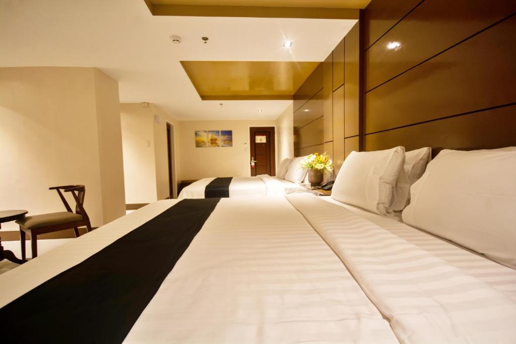 Postel nebo postele na pokoji v ubytování ECL Resort Hotel Boracay