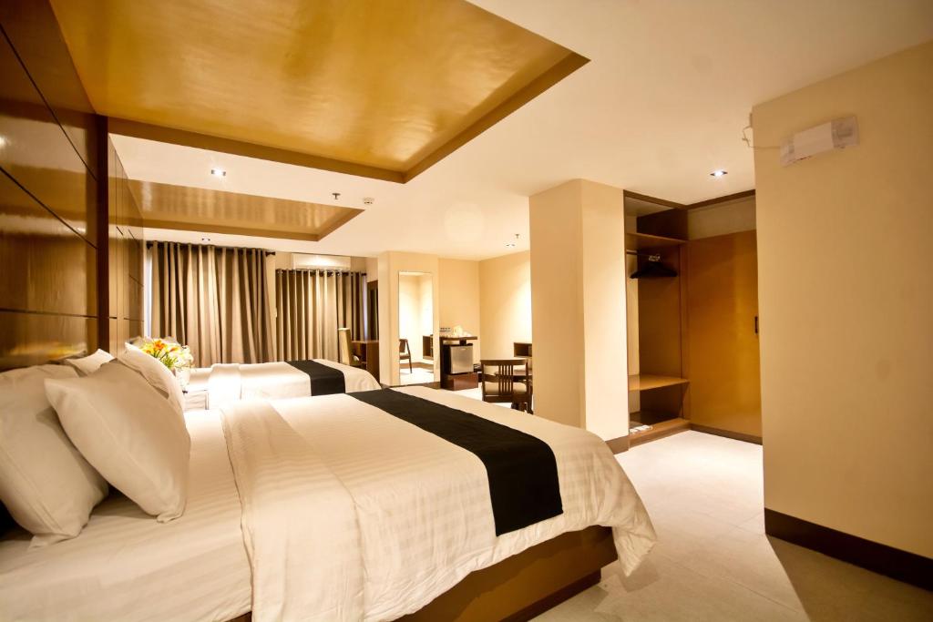 Postel nebo postele na pokoji v ubytování ECL Resort Hotel Boracay