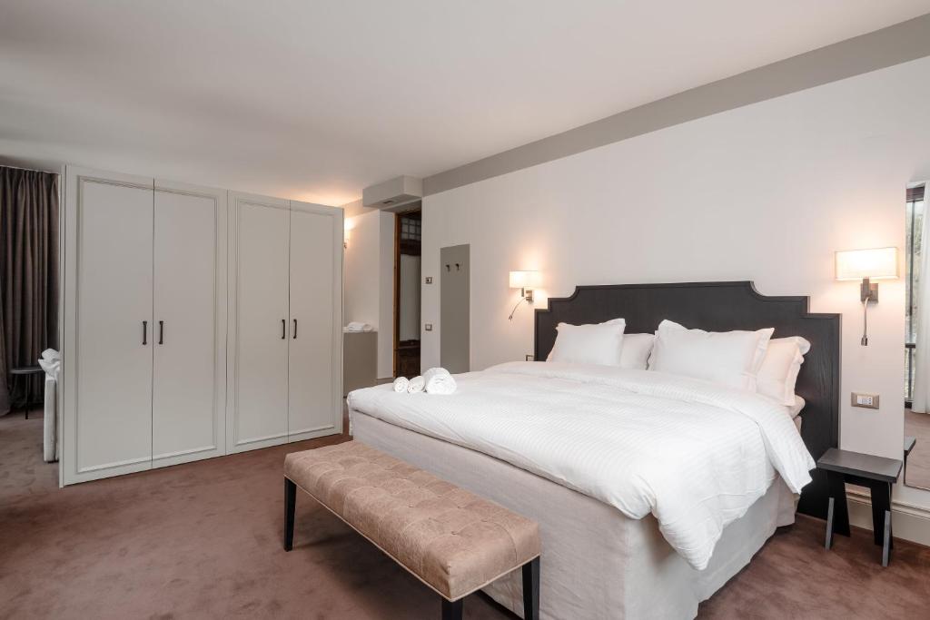 Postel nebo postele na pokoji v ubytování Villa Carona Hotel & Spa