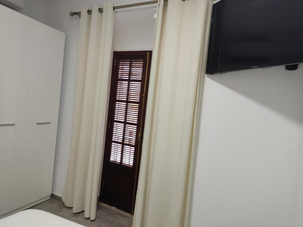 TV a/nebo společenská místnost v ubytování Apartamentos BARBAS