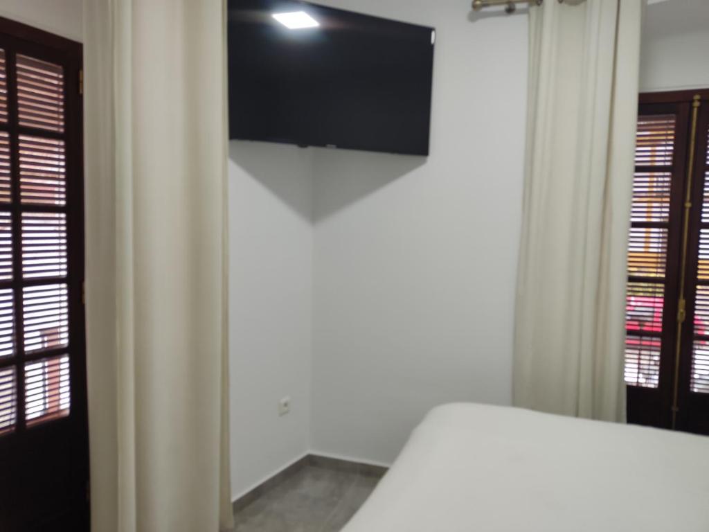 TV a/nebo společenská místnost v ubytování Apartamentos BARBAS