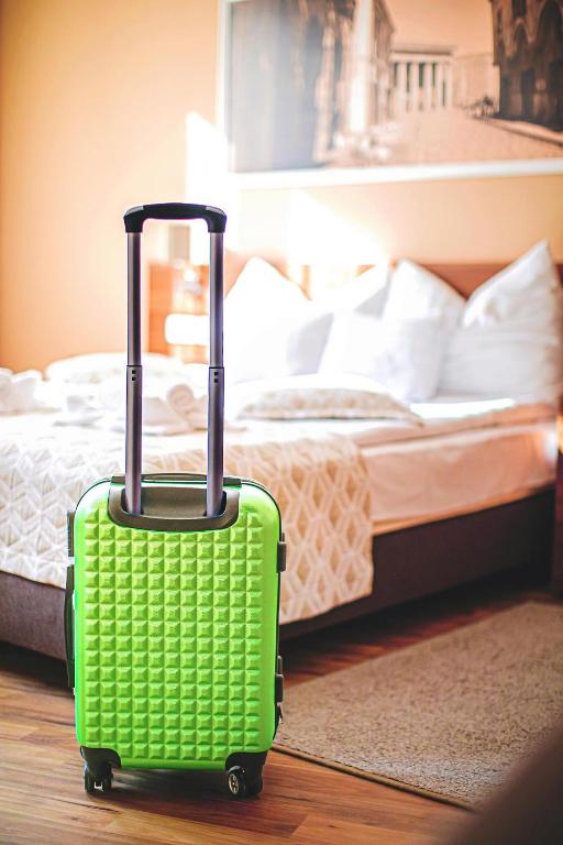 Postel nebo postele na pokoji v ubytování Forum Hotel