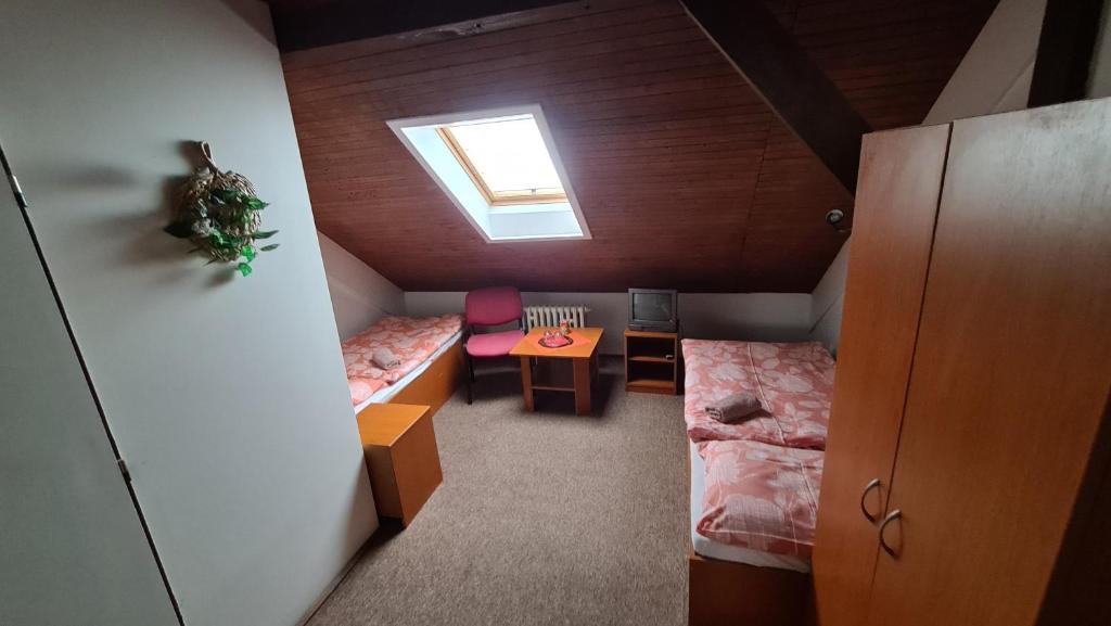 Postel nebo postele na pokoji v ubytování Penzion Olympia