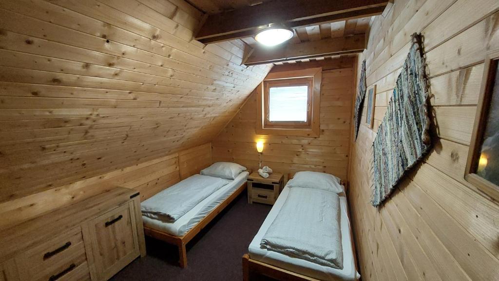 Postel nebo postele na pokoji v ubytování Chata Raj