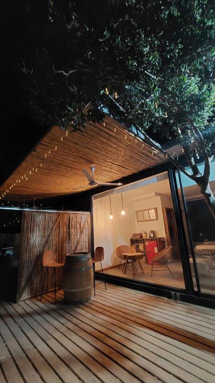 a view of a deck with a table and chairs at Apalta Lofts, disfruta frente a viñedos in Santa Cruz