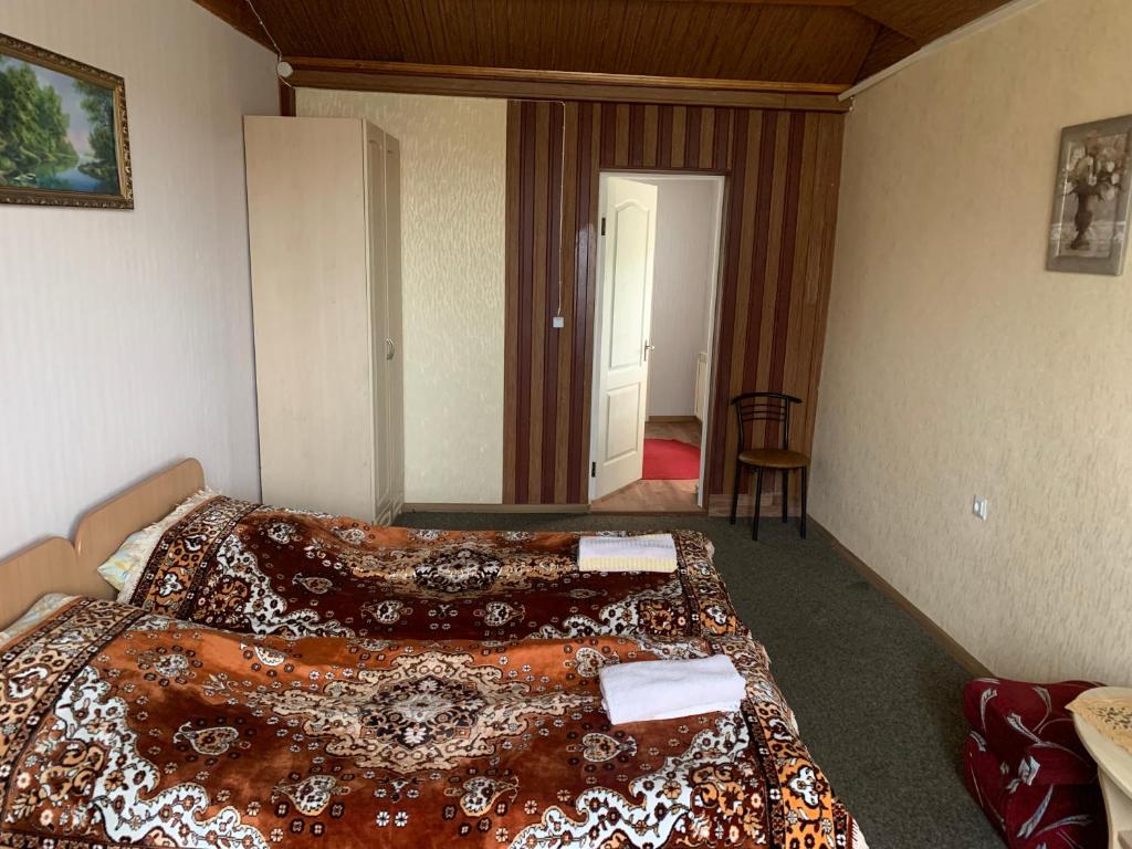 Postel nebo postele na pokoji v ubytování Villa Yaryna