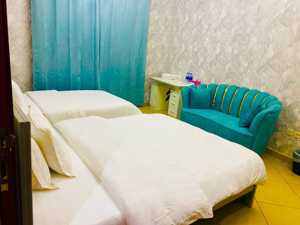 Postel nebo postele na pokoji v ubytování Jin Jie Residence