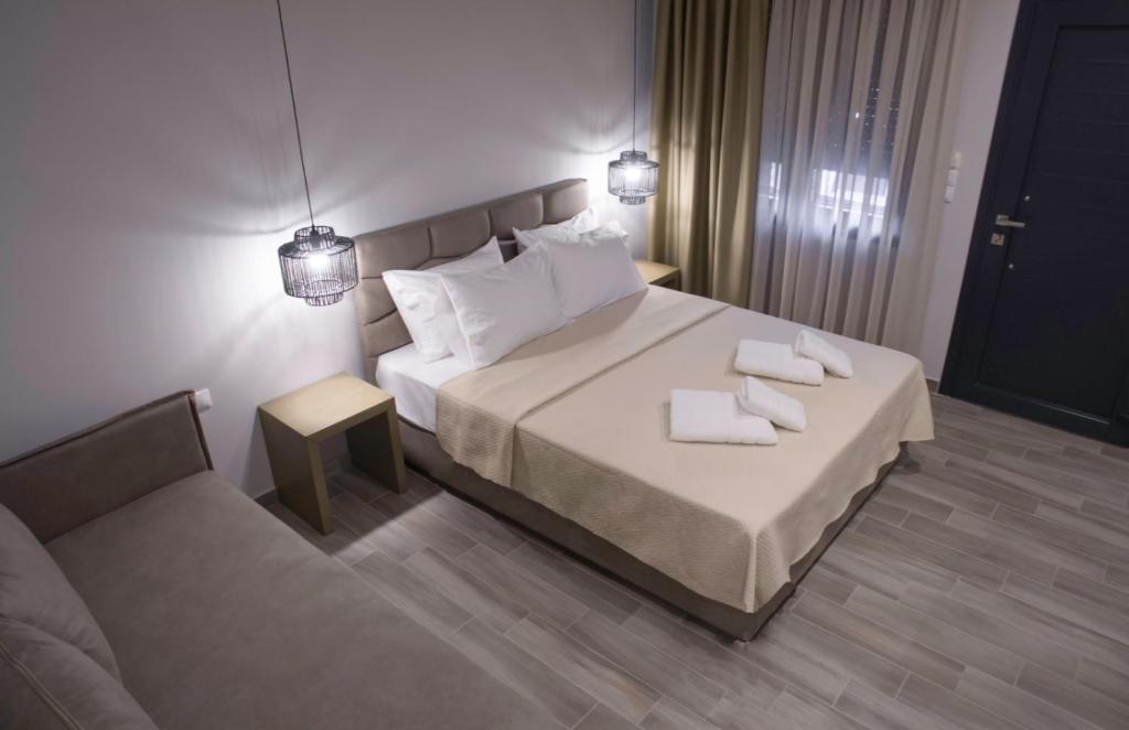 Postel nebo postele na pokoji v ubytování Perla Inn
