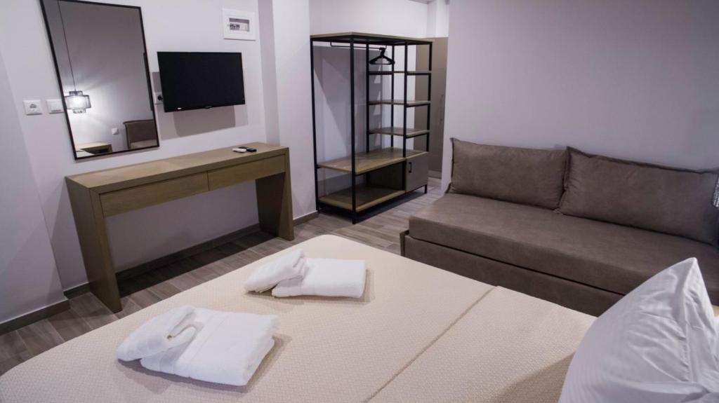 Postel nebo postele na pokoji v ubytování Perla Inn