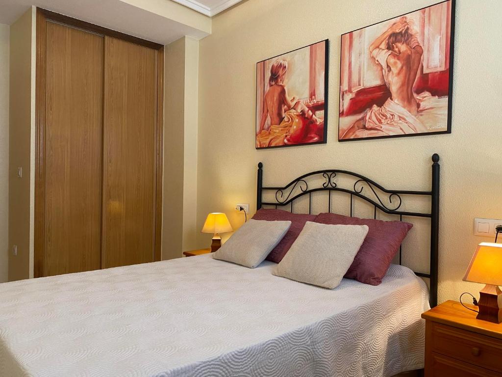 Postel nebo postele na pokoji v ubytování APARTAMENTO MARIA PLAYA DEL CURA