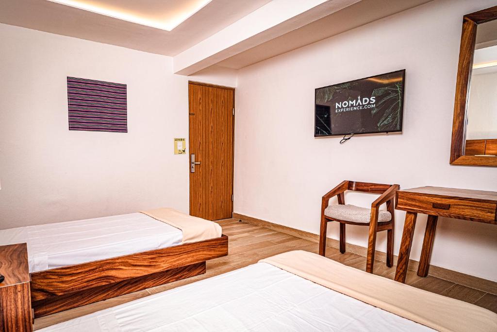 Postel nebo postele na pokoji v ubytování Nomads Party Hotel