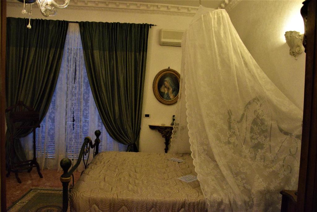 Posteľ alebo postele v izbe v ubytovaní B&B Vittoria Colonna
