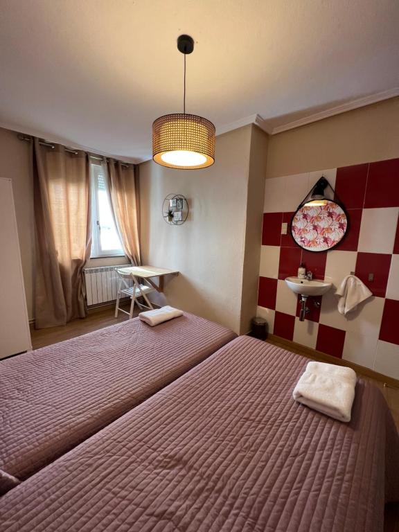 Postel nebo postele na pokoji v ubytování Hosteria Tajahierro