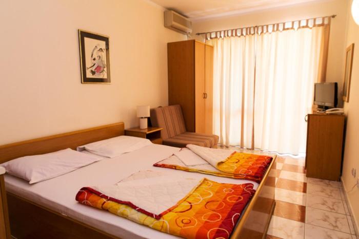 Postel nebo postele na pokoji v ubytování Hotel Obala