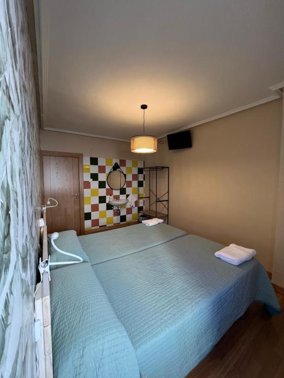 Postel nebo postele na pokoji v ubytování Hosteria Tajahierro