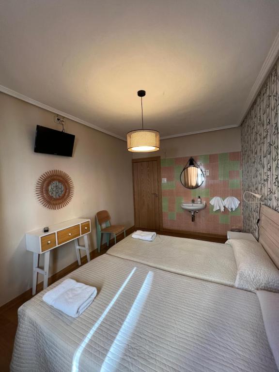 Postel nebo postele na pokoji v ubytování Hosteria Tajahierro