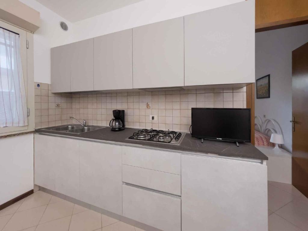 Kuchnia lub aneks kuchenny w obiekcie Apartments in Lignano 21774