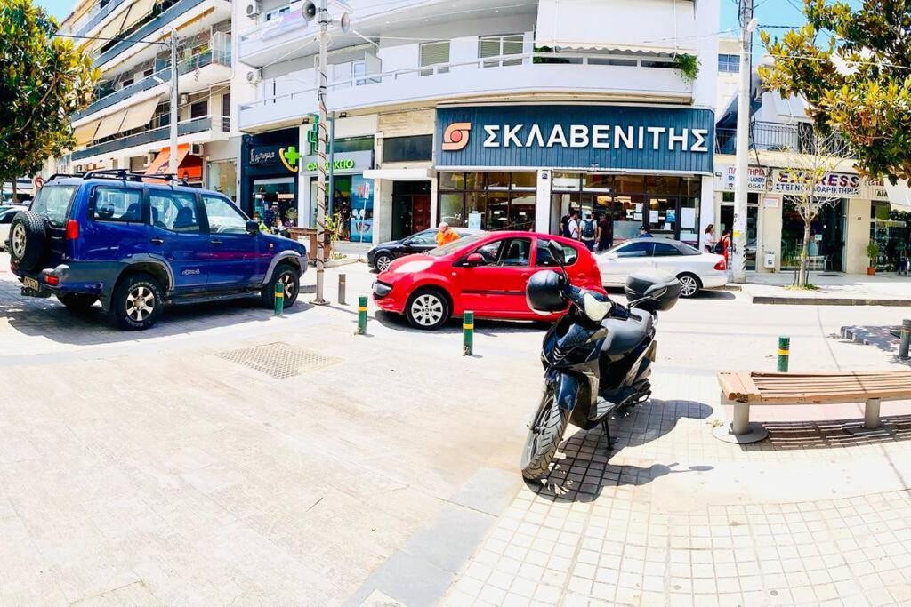 a motorcycle parked on a street in a city at SeaSide House 37 Θουκιδιδου,Alimos in Athens