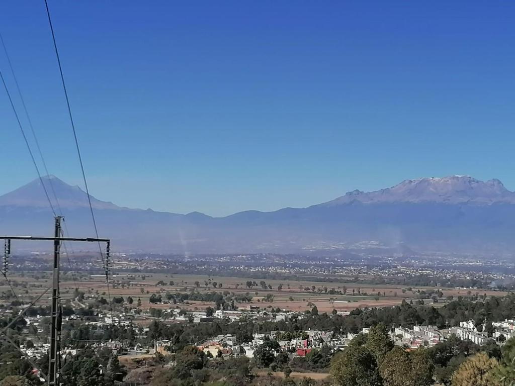 a view of a city with mountains in the background at PRECIOSA CASA NUEVA UNA PLANTA NAMASTE 