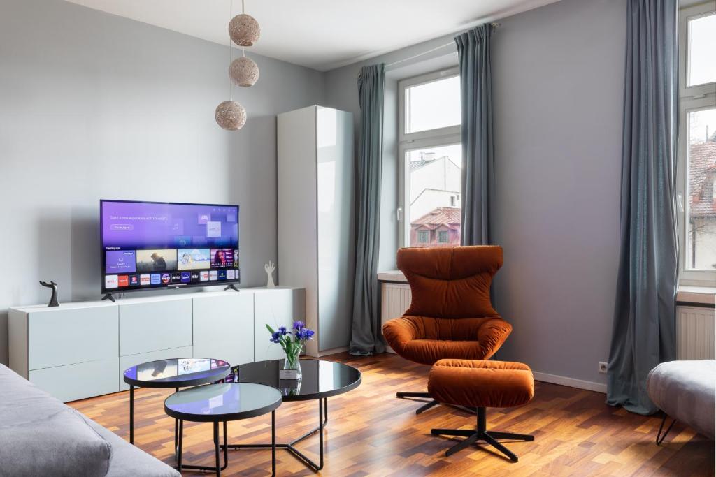 Televízia a/alebo spoločenská miestnosť v ubytovaní Rainbow Apartments 1