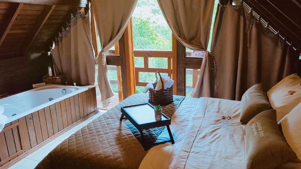 Postel nebo postele na pokoji v ubytování Cabanas dos Plátanos