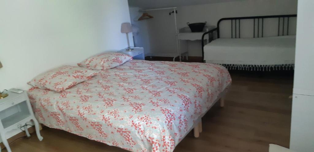 Posteľ alebo postele v izbe v ubytovaní L'Etang Des Cigales