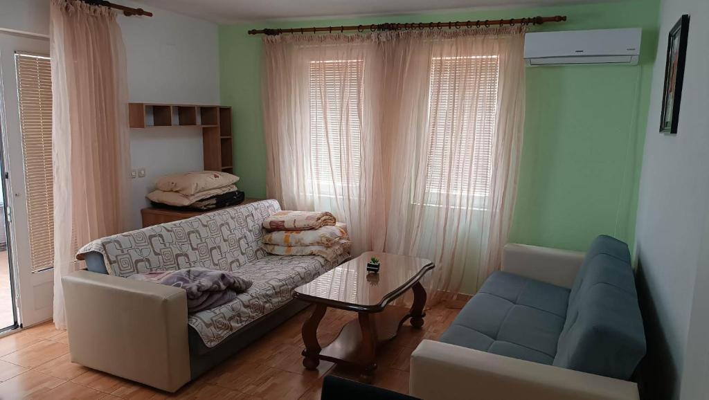 a living room with a couch and a table at Mountain Villa Petkoski in Ohrid