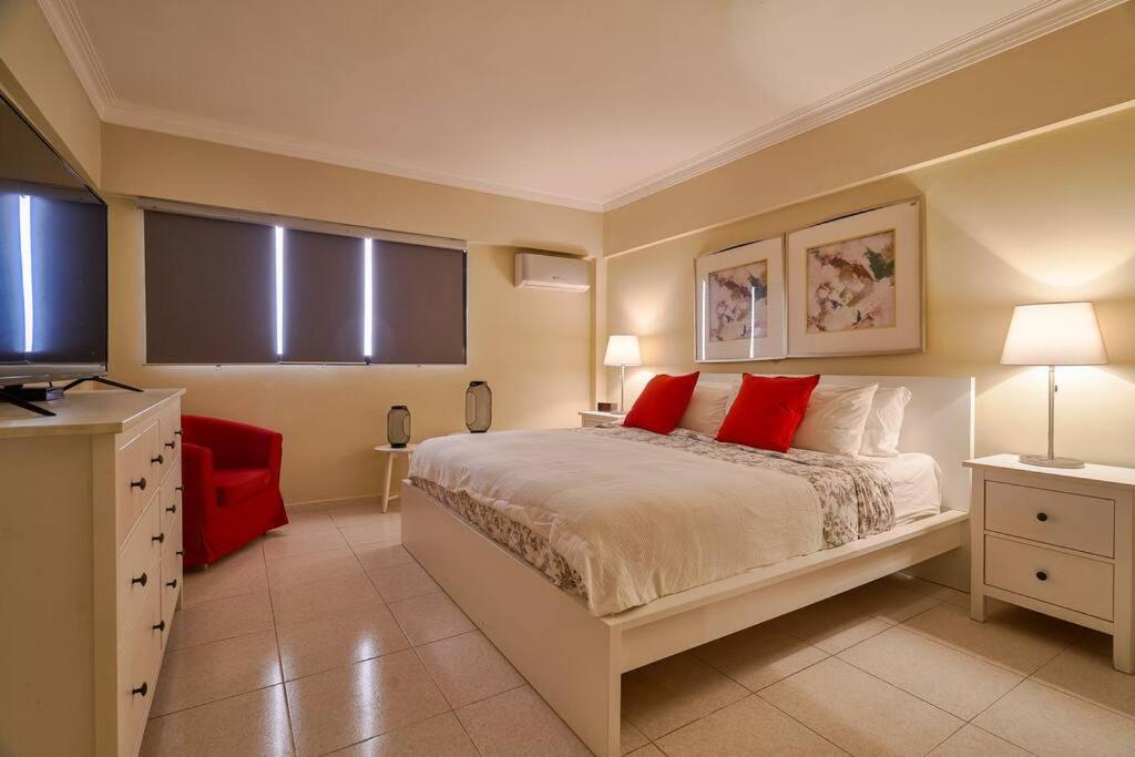 A bed or beds in a room at Classy Harmony Penthouse Close to Acropolis Center