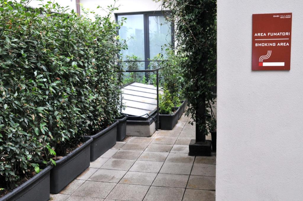 Een tuin van Oasi Village Hotel