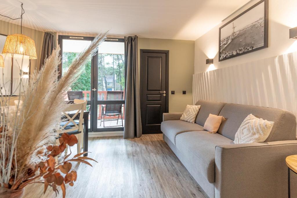Część wypoczynkowa w obiekcie MC Tourisme - Splendide & cosy appartement avec piscine, tennis & parking