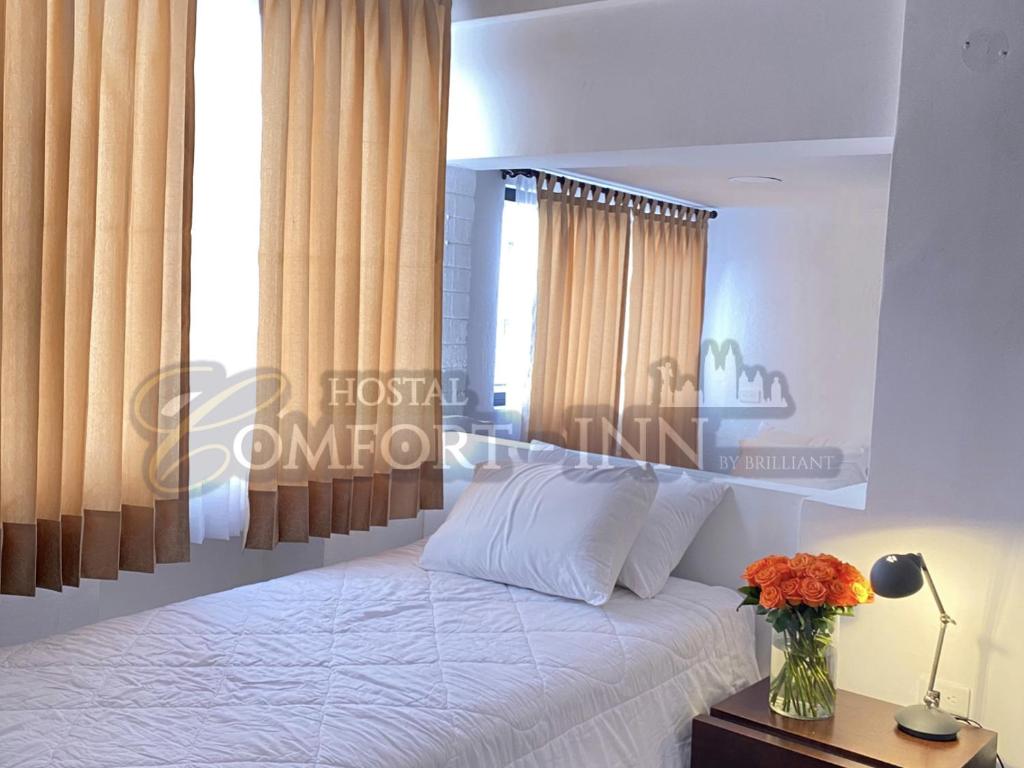 Postel nebo postele na pokoji v ubytování HOTEL COMFORT- Inn