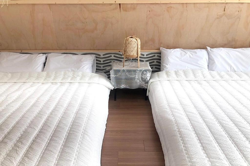 Postel nebo postele na pokoji v ubytování Cheukhu-dong 19street Guesthouse