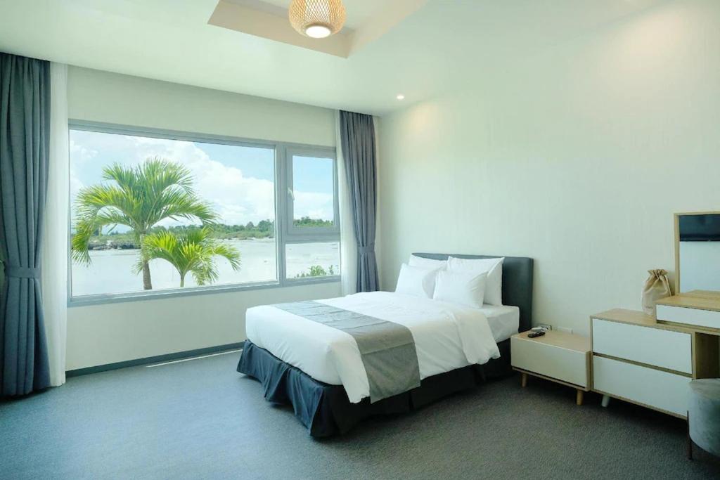 Postel nebo postele na pokoji v ubytování Cube9 Resort & Spa 큐브9 리조트 & 스파