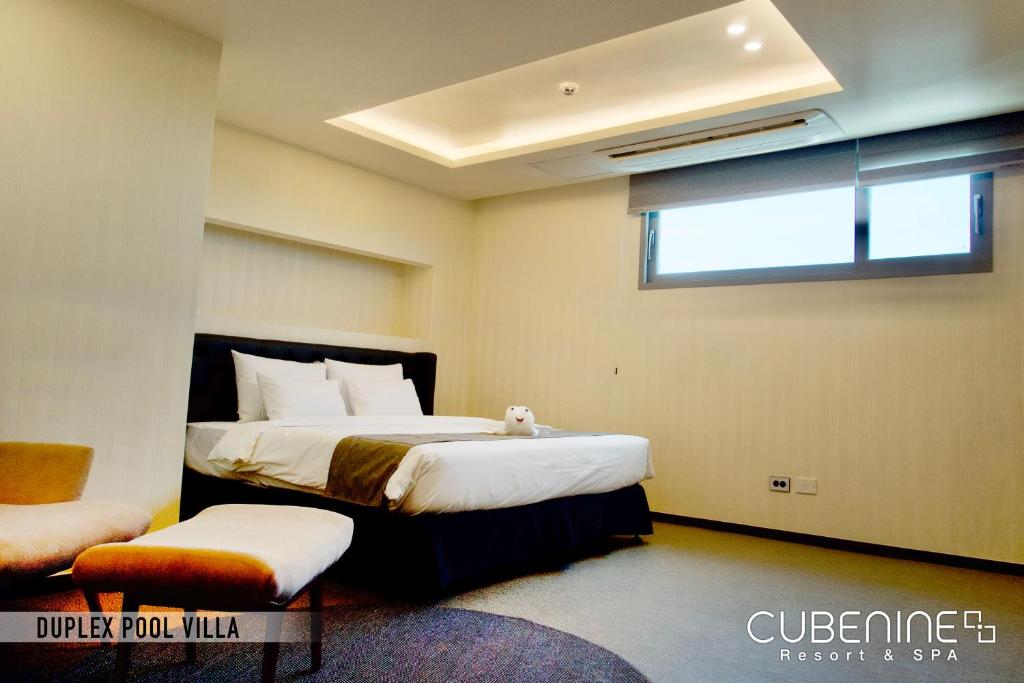 Postel nebo postele na pokoji v ubytování Cube9 Resort & Spa 큐브9 리조트 & 스파