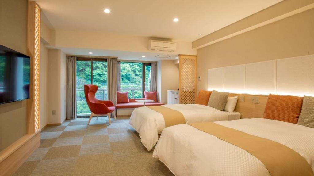 Postel nebo postele na pokoji v ubytování Kinugawa Onsen Hotel